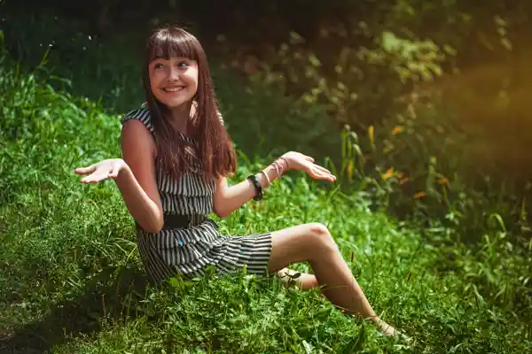 A young girl shrugging